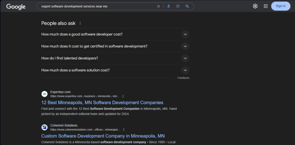 Google SERPS showing organic listings beneath people also ask section for “expert software development services” search query
